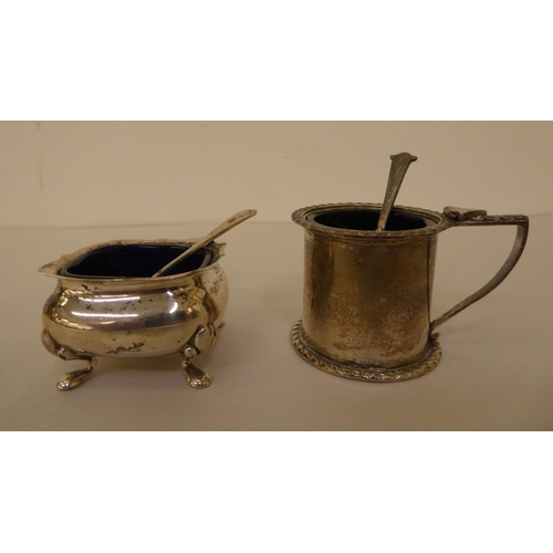 303 - Silver and white metal items: to include two napkin rings and two silver thimbles 