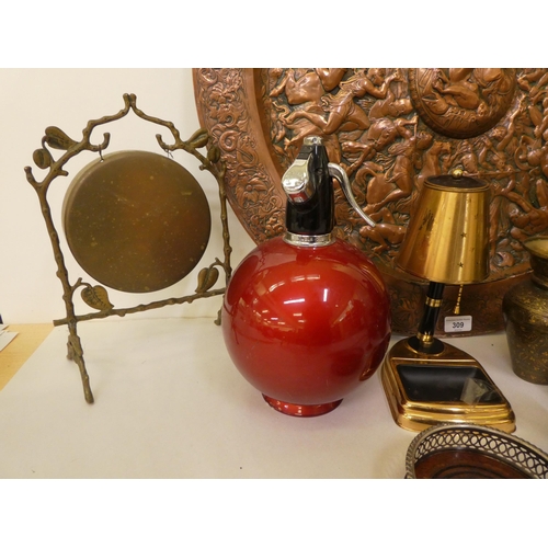 309 - Early 20thC functional metalware: to include a pressed copper charger  27