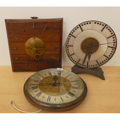 316 - Clocks: to include a cast metal Synclock electric example, faced by a Roman dial  13