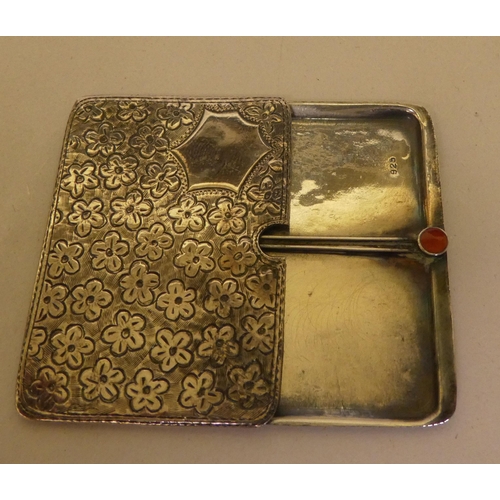 328 - A silver double stamp case with an engraved sliding top 