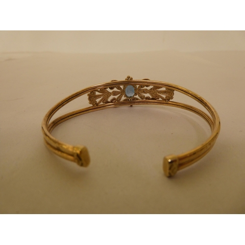 334 - A 9ct gold topaz and diamond open end bangle