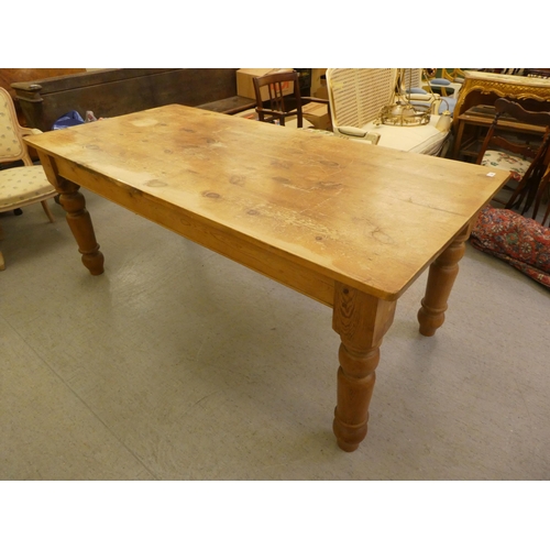 342 - A modern pine farmhouse table, raised on turned, tapered legs  30