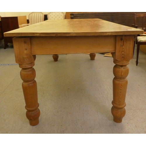 342 - A modern pine farmhouse table, raised on turned, tapered legs  30