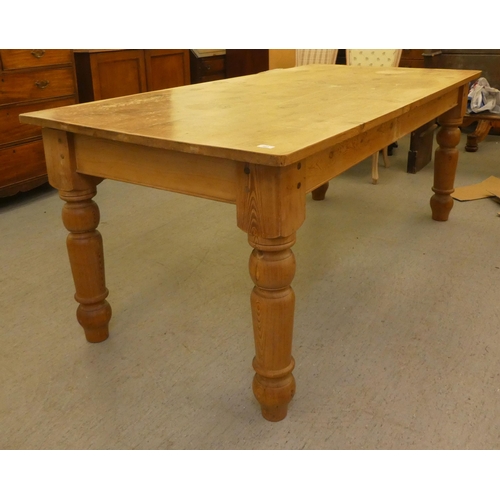 342 - A modern pine farmhouse table, raised on turned, tapered legs  30