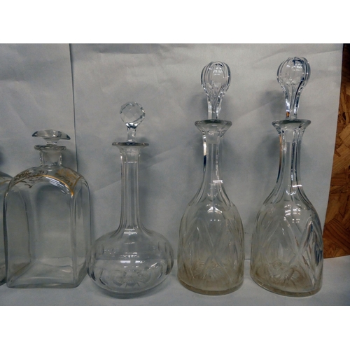 35 - Glassware: to include a pair of mid 19thC decanters and stoppers of shouldered box design  9.5