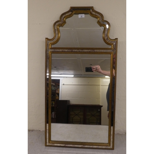 39 - A modern mirror, the sectional plates set in a moulded gilt frame  39