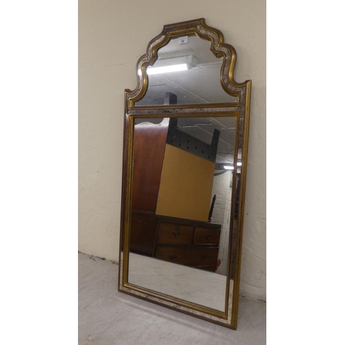 39 - A modern mirror, the sectional plates set in a moulded gilt frame  39