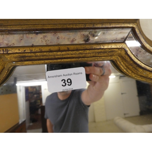 39 - A modern mirror, the sectional plates set in a moulded gilt frame  39