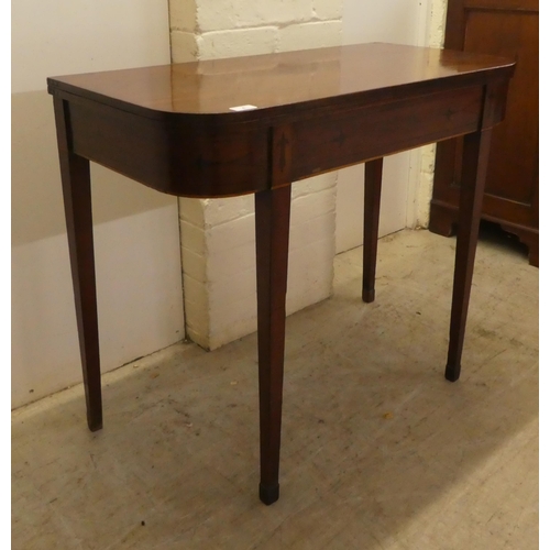 4 - A late Victorian mahogany D-end tea table, the foldover top raised on square, tapered legs  29.... 