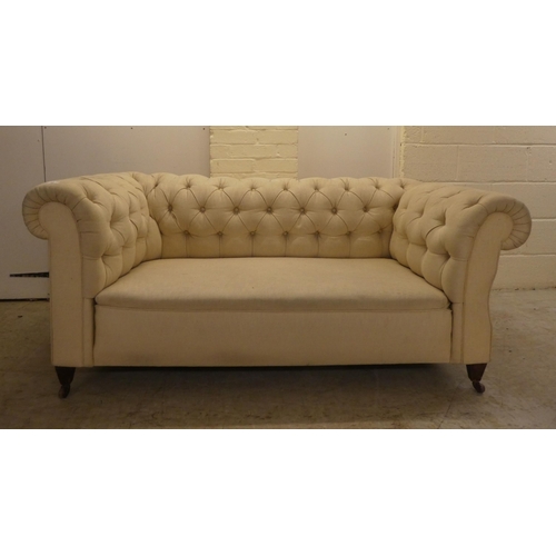 44 - A mid 19thC and later fabric upholstered, drop-end Chesterfield, raised on square legs and casters  ... 