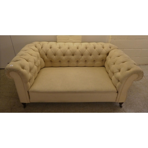 44 - A mid 19thC and later fabric upholstered, drop-end Chesterfield, raised on square legs and casters  ... 