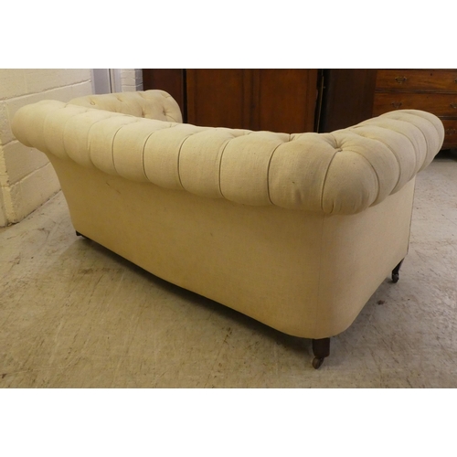 44 - A mid 19thC and later fabric upholstered, drop-end Chesterfield, raised on square legs and casters  ... 