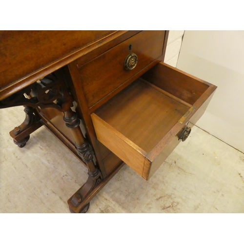 51 - A late Victorian mahogany Davenport, having a sloping, hinged lid with a tooled green hide scriber, ... 