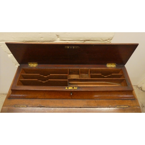 51 - A late Victorian mahogany Davenport, having a sloping, hinged lid with a tooled green hide scriber, ... 