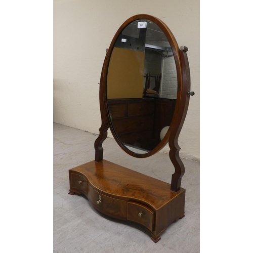 63 - A Regency satinwood inlaid, mahogany serpentine front dressing table mirror with a box section base ... 