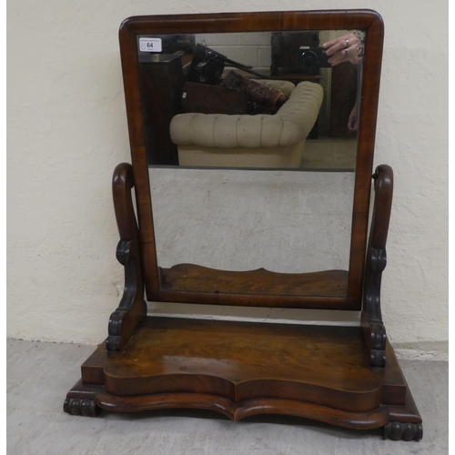 64 - A mid Victorian mahogany framed dressing table mirror, on a stepped serpentine front plinth  24... 