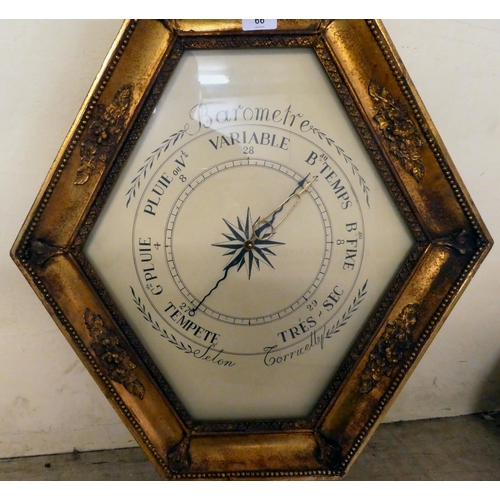 66 - A modern barometer, in an ornate gilded frame with a carved cornice  37