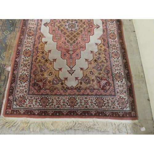 75 - Rugs: to include a Persian example with a central gul, on a red ground  82