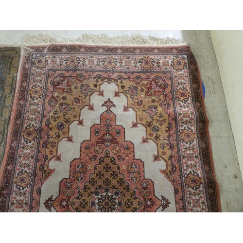 75 - Rugs: to include a Persian example with a central gul, on a red ground  82