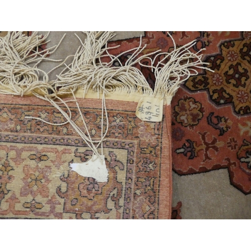 75 - Rugs: to include a Persian example with a central gul, on a red ground  82