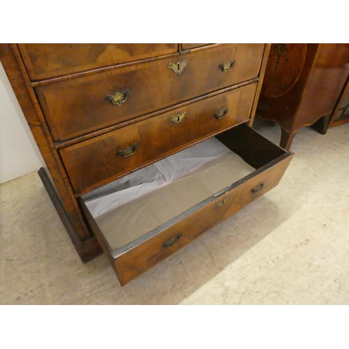 8 - A late 18thC crossbanded and quarter veneered, mahogany five drawer dressing chest, on a plinth and ... 