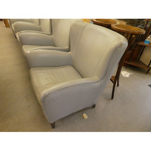 245 - A set of five modern Morgan Furniture, grey hide upholstered enclosed armchairs, raised on square, t... 