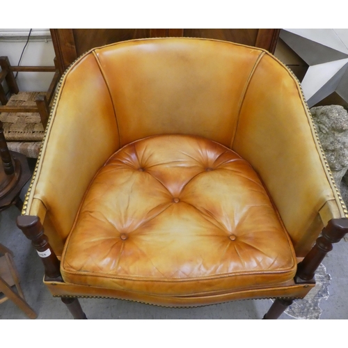 255 - A modern Georgian design, round back,  mahogany framed chair, stud upholstered in tan coloured hide,... 