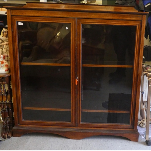 48 - An Edwardian satinwood inlaid rosewood cabinet with two glazed doors, on a plinth  51