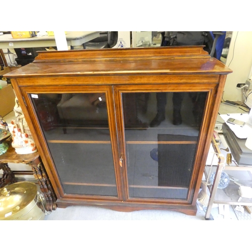 48 - An Edwardian satinwood inlaid rosewood cabinet with two glazed doors, on a plinth  51