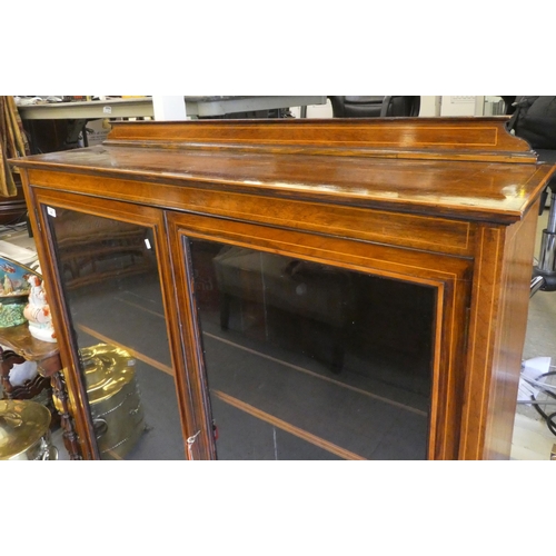 48 - An Edwardian satinwood inlaid rosewood cabinet with two glazed doors, on a plinth  51