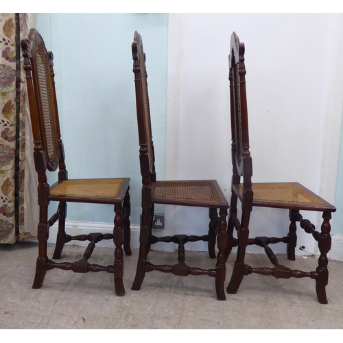 105 - A set of six early/mid 20thC oak framed traditional English style dining chairs with caned backs and... 