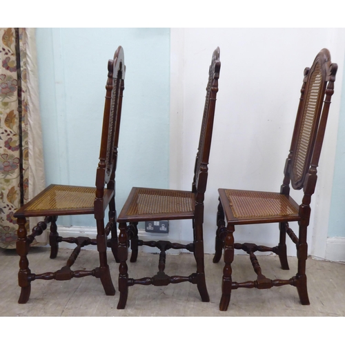 105 - A set of six early/mid 20thC oak framed traditional English style dining chairs with caned backs and... 