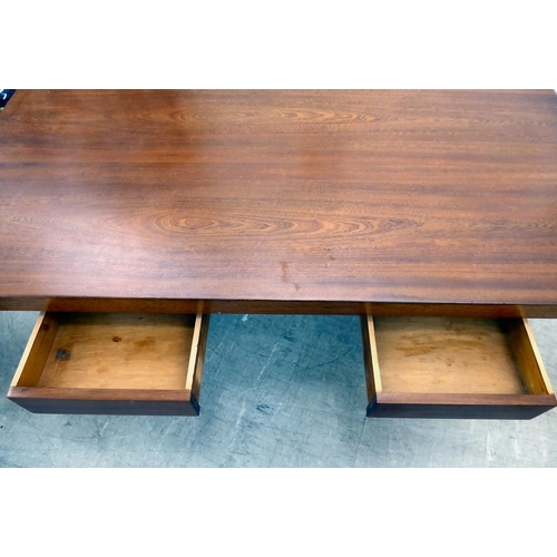 115 - A circa 1960/70s teak one-piece desk with two drawers, raised on two lozenge shaped pedestals  31