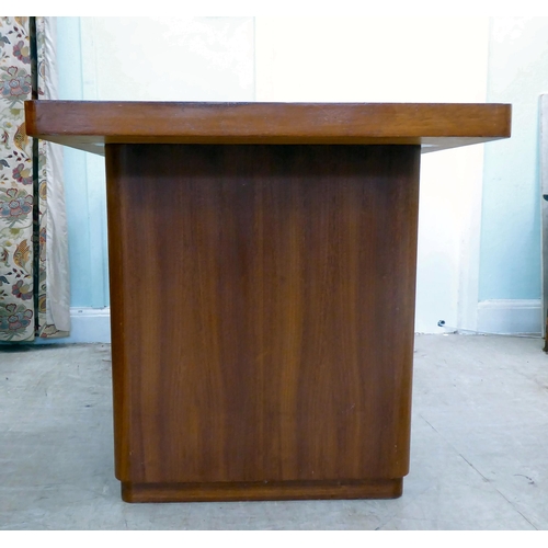 115 - A circa 1960/70s teak one-piece desk with two drawers, raised on two lozenge shaped pedestals  31