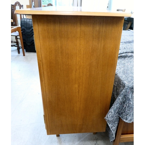 117 - A 1960/70s Produit Suisse Schweizerjabrikat teak sideboard with four doors, enclosing open shelves, ... 