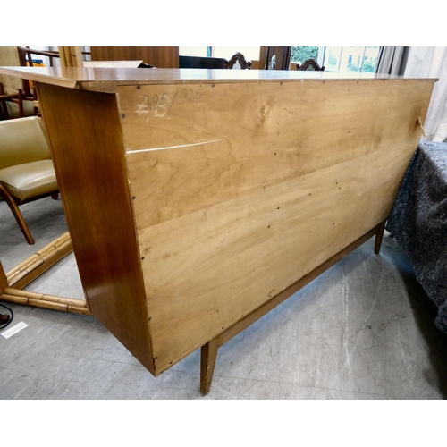 117 - A 1960/70s Produit Suisse Schweizerjabrikat teak sideboard with four doors, enclosing open shelves, ... 