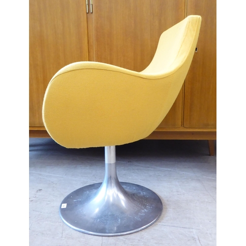 118 - A circa 1950/60s (possibly Italian) swivel desk chair, upholstered in yellow fabric, raised on a ste... 