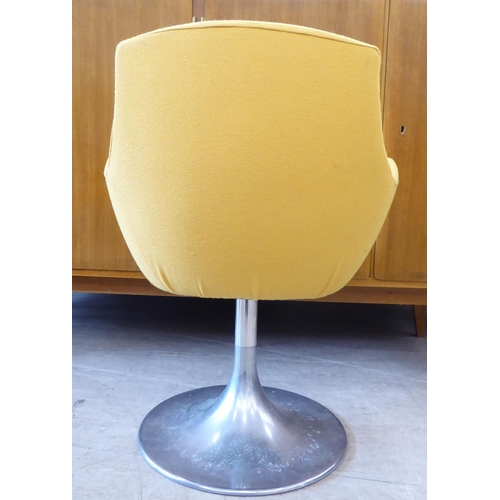 118 - A circa 1950/60s (possibly Italian) swivel desk chair, upholstered in yellow fabric, raised on a ste... 