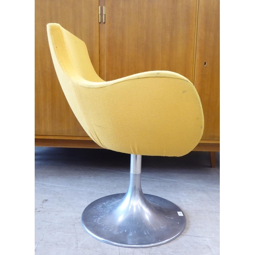 118 - A circa 1950/60s (possibly Italian) swivel desk chair, upholstered in yellow fabric, raised on a ste... 