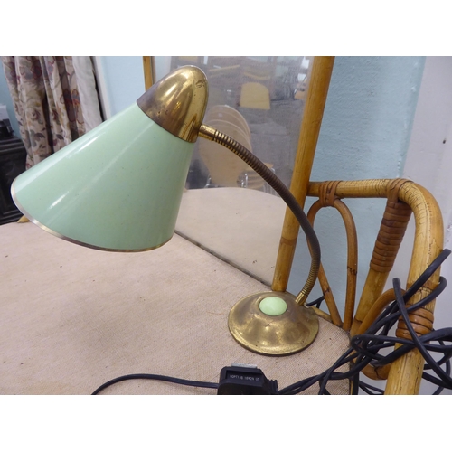 119 - A circa 1960/70s cane bound bamboo framed one-piece dressing table with a mirror, over a rattan cove... 