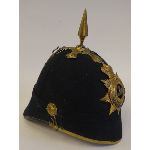 120 - An early 20thC design East Lancashire Regiment Home Service helmet(Please Note: this lot is subject ... 