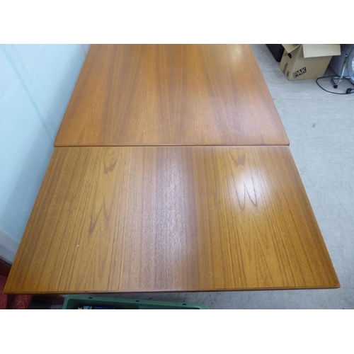 121 - A circa 1960s Henning Kjaernulf for Vejle Stole & Mobeljubrik teak dining table with two draw le... 