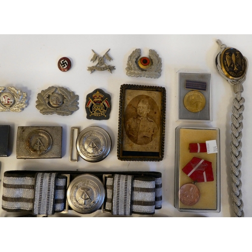 122 - Military collectables, some copies: to include a Spanish Civil War brass belt buckle(Please Note: th... 