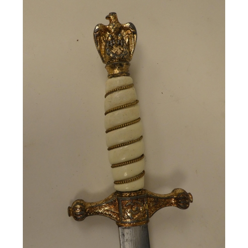 124 - A German World War II era naval dagger with a wire bound celluloid grip, the blade inscribed 'Alcosa... 