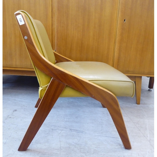 126 - A walnut framed and hide upholstered lounge chair by Neil Morris, raised on splayed legs