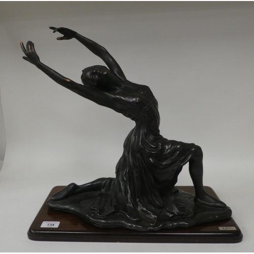 134 - A modern bronze effect moulded resin figure, a female ballet dancer  17