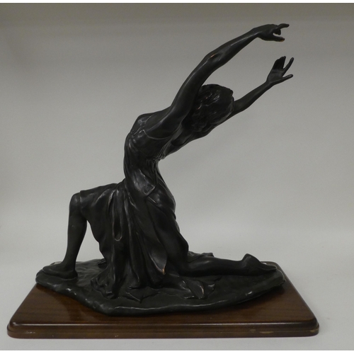 134 - A modern bronze effect moulded resin figure, a female ballet dancer  17