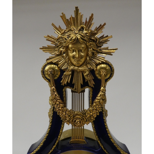 155 - A modern Marie Antoinette clock, produced for the V&A Museum, the gilded midnight blue porcelain... 