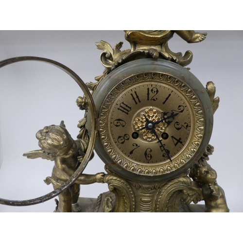 166 - A late 19thC Continental, gilded metal and green onyx cased mantel clock, featuring cavorting cherub... 