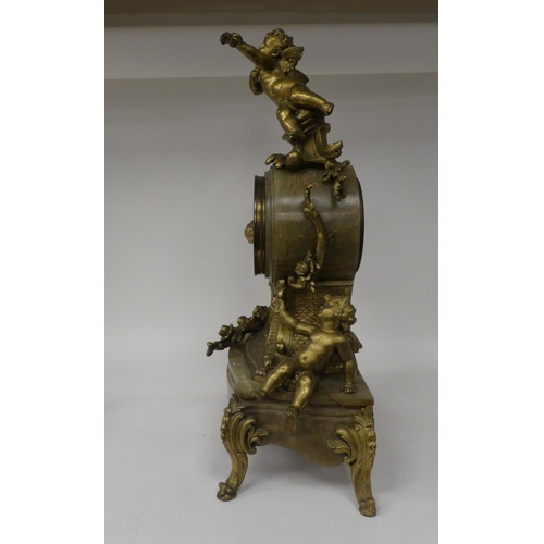 166 - A late 19thC Continental, gilded metal and green onyx cased mantel clock, featuring cavorting cherub... 